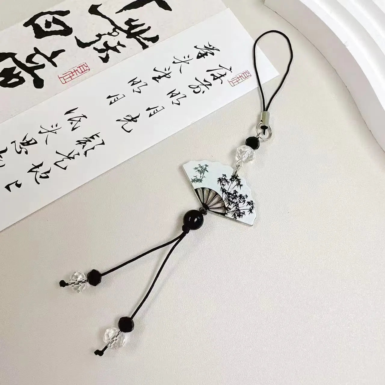 Guofeng floral pattern ceramic bead pendant keychain with Chinese style design.