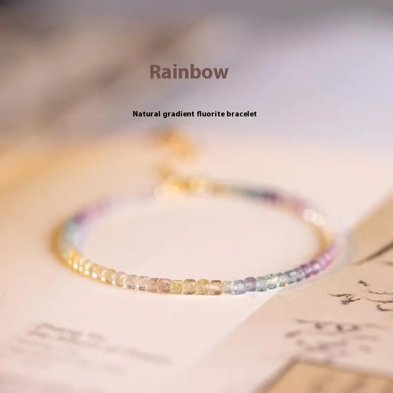 Handmade women's rainbow fluorite bracelet with copper and geometric quadrilateral shape