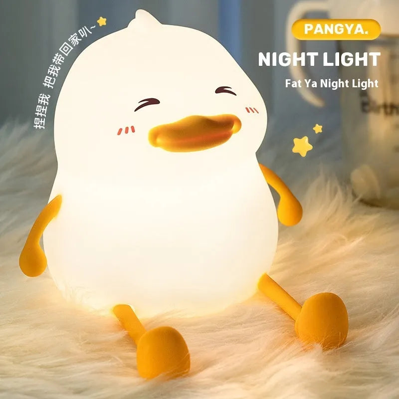 Chubby night light desk lamp with silicone phone holder surface showing three brightness settings