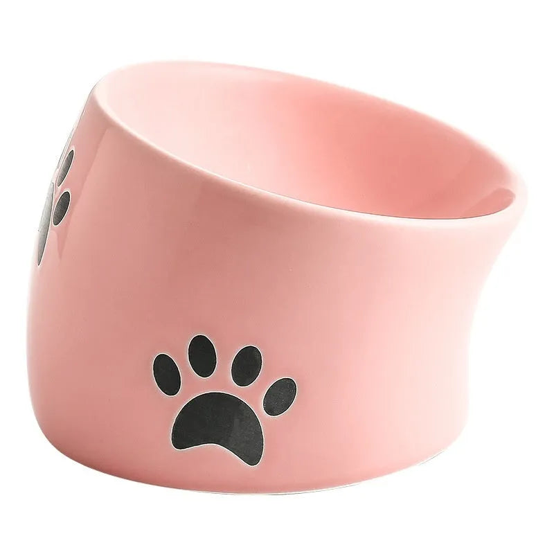 Ceramic cat bowl with oblique mouth and high foot, available in cat's paw colours pink, yellow, black, white