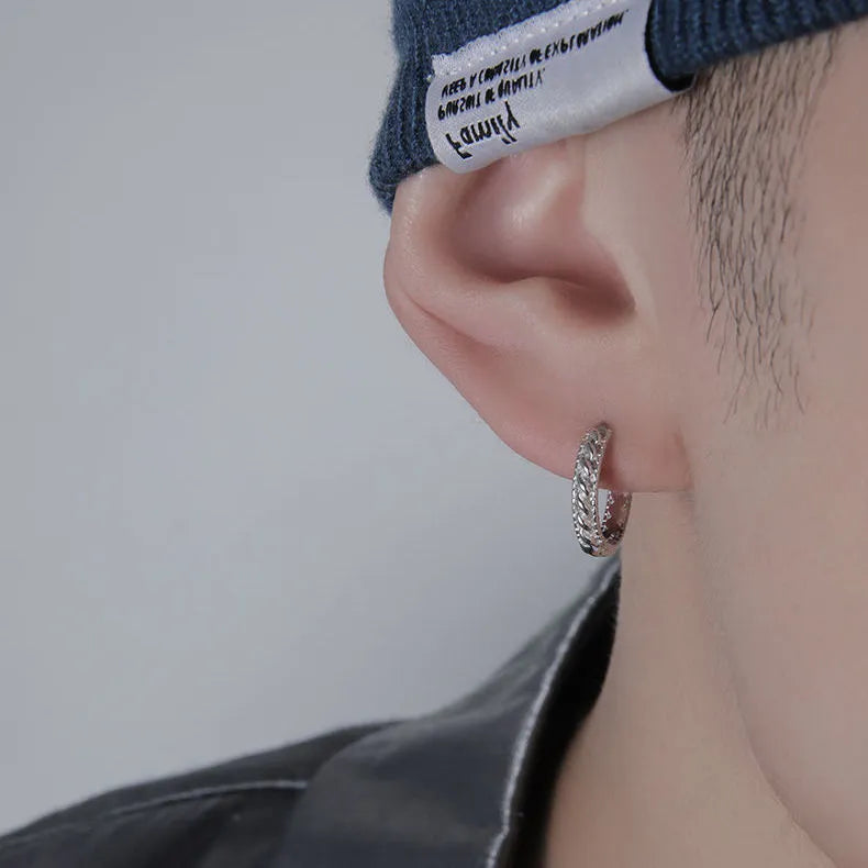 Simple geometric men's silver-tone earrings on a plain background showing front and side views.