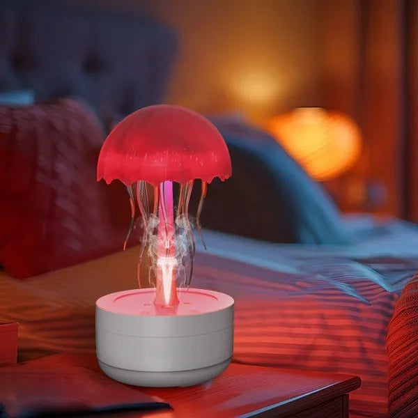 White resin jellyfish humidifier diffuser with 7-colour night light and touch controls on a desk