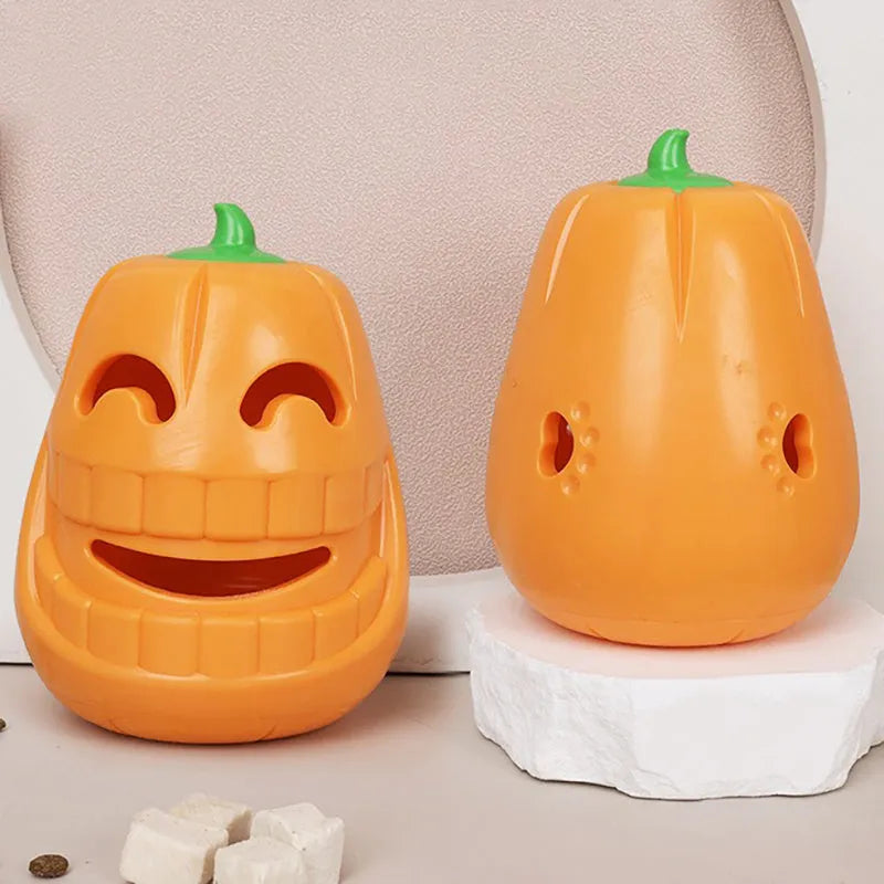 Orange Halloween pumpkin-shaped dog chew toy with a treat-dispensing funnel opening.