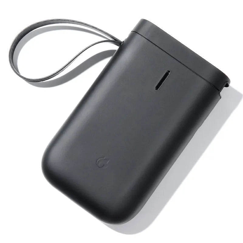 D11 Bluetooth thermal label printer in compact black design with thermal paper roll