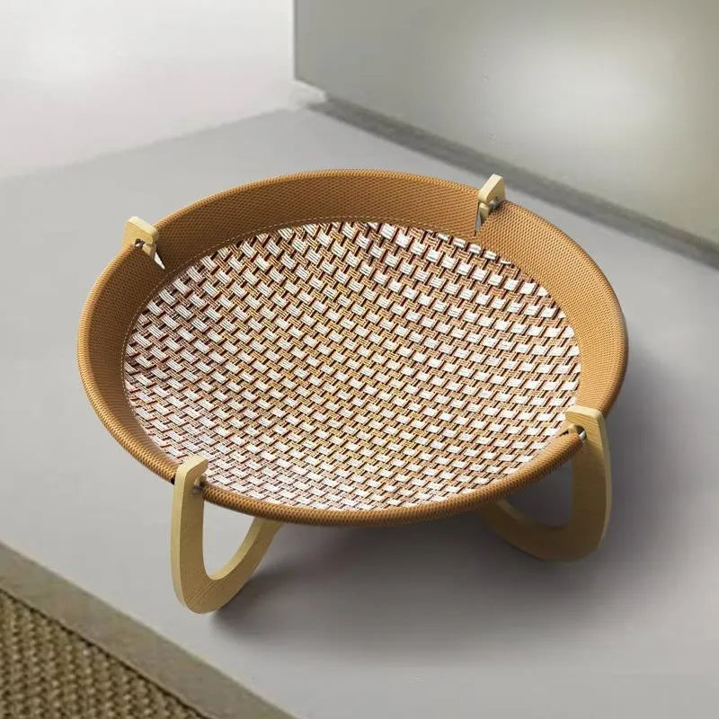 Brown woven rattan pet hammock bed for cats and dogs on a cool mat.