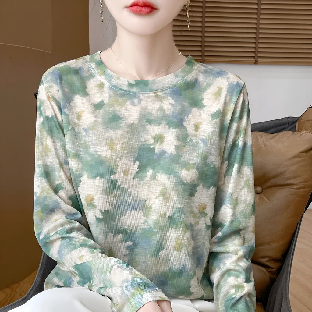 Ladies' round neck pullover shirt with floral printed design in Tencel cotton knit fabric.