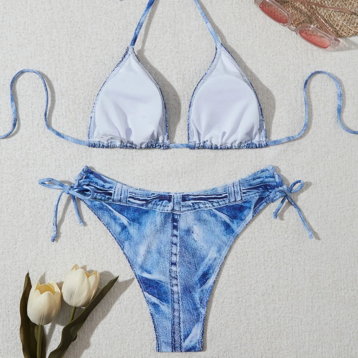 Women's denim blue printed bikini set with strap design, shown as a two-piece swimsuit.