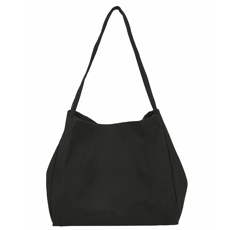 Solid colour women's canvas handbag in black with double shoulder straps and external sandwich pocket