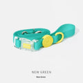 Nylon dog collar and hand holding rope set in smoky gray, new green, lemon yellow, and rose pink
