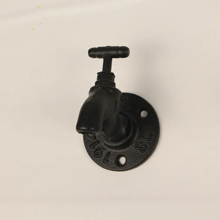 Water pipe style wall mounted towel hook in polished metal with industrial design