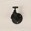 Water pipe style wall mounted towel hook in polished metal with industrial design