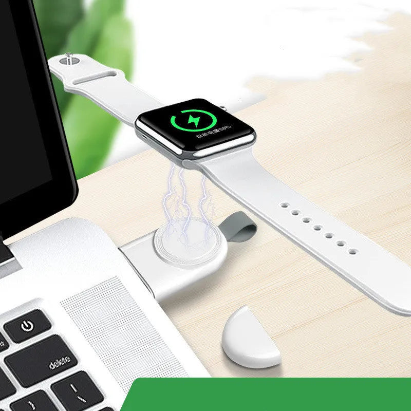 Portable wireless Apple Watch charging dock in white on a desk, with USB cable attached