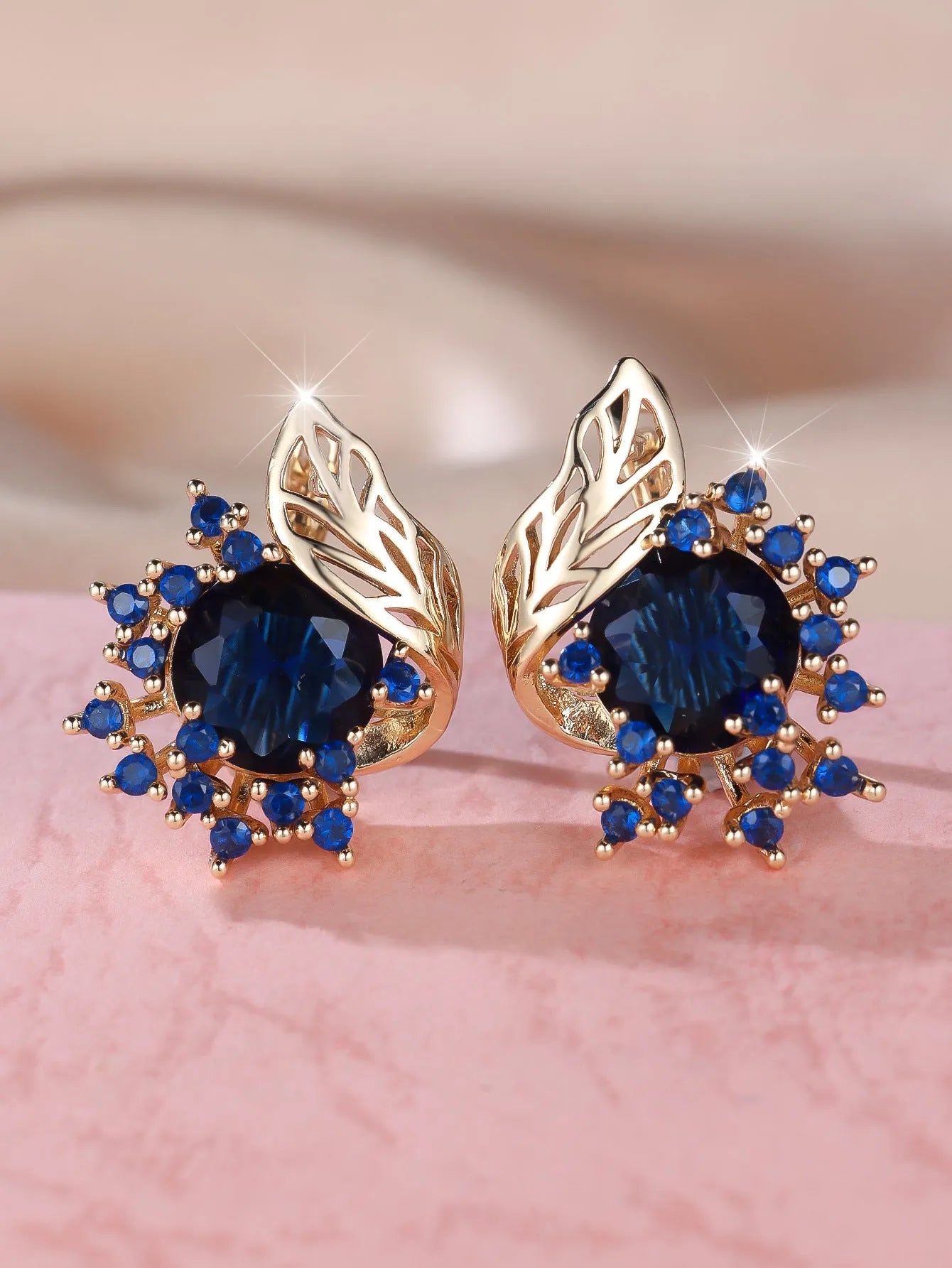 Round floral feather earrings with zircon stone centre in champagne gold finish, available in six coloured diamond options