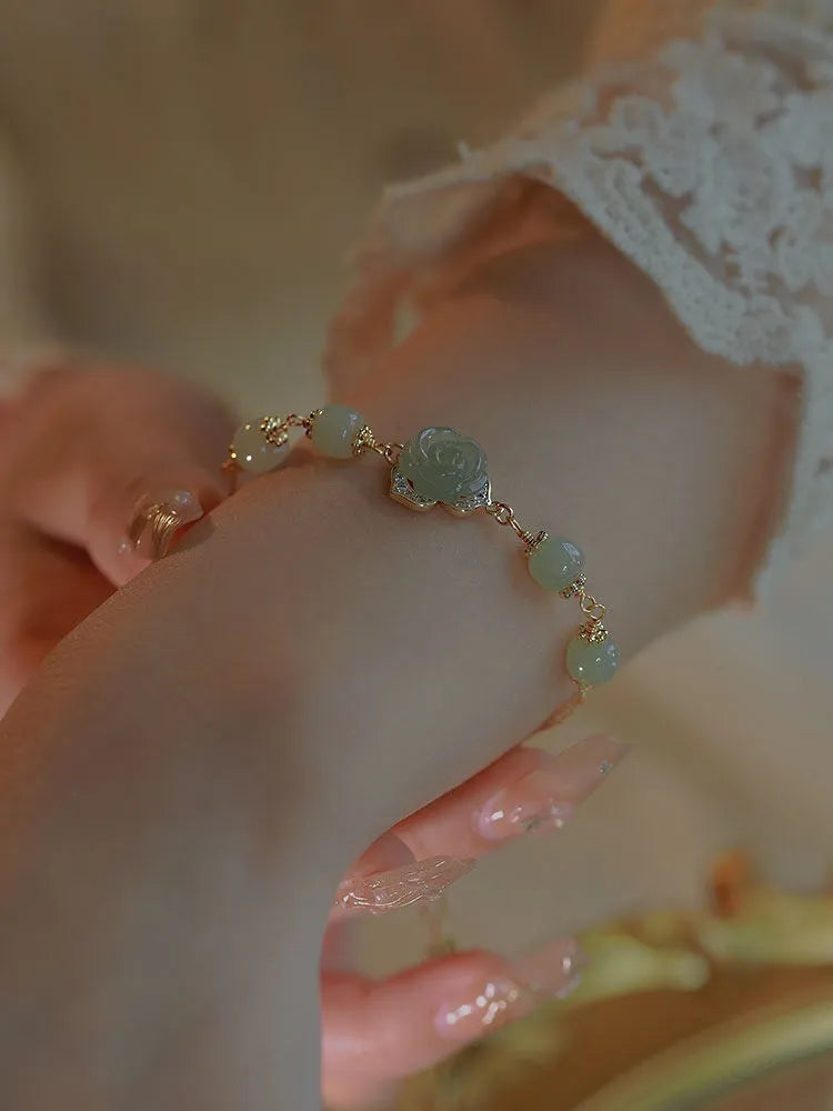Women's bracelet with Hetian jade rose flower design and 14K gilded construction