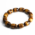 Natural yellow tigereye bracelet with sunny cat eye effect, ball beads in 11x16mm size on light background