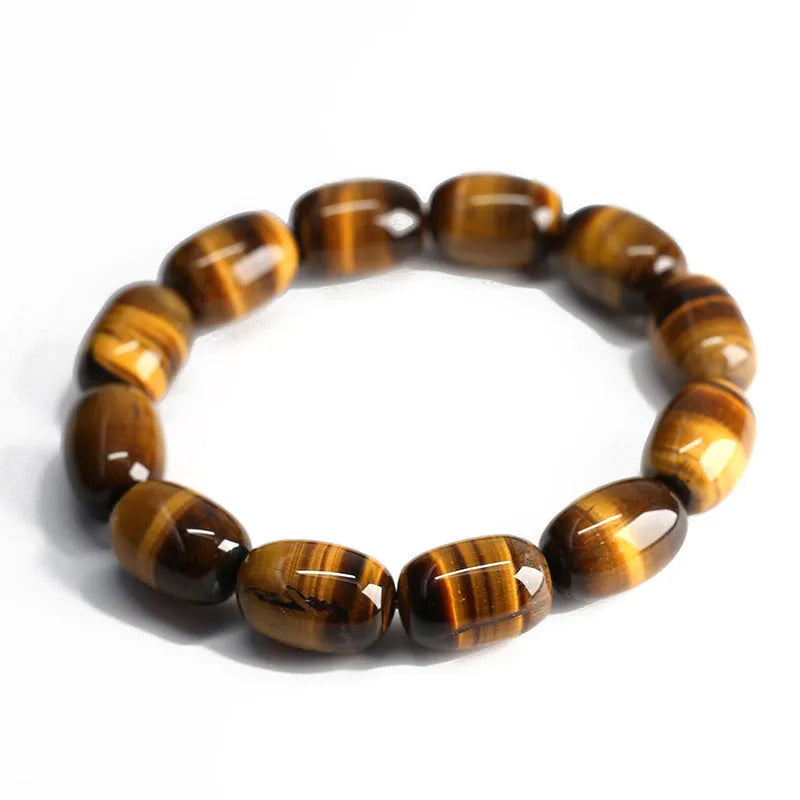 Natural yellow tigereye bracelet with sunny cat eye effect, ball beads in 11x16mm size on light background