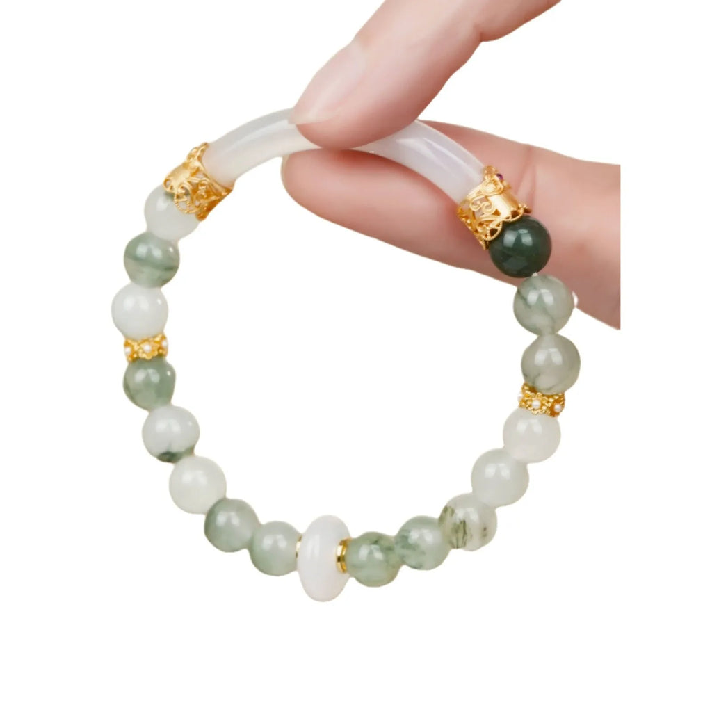 Emerald green Tian Shan Cui half bracelet with floating flower girl design and round motif on light background