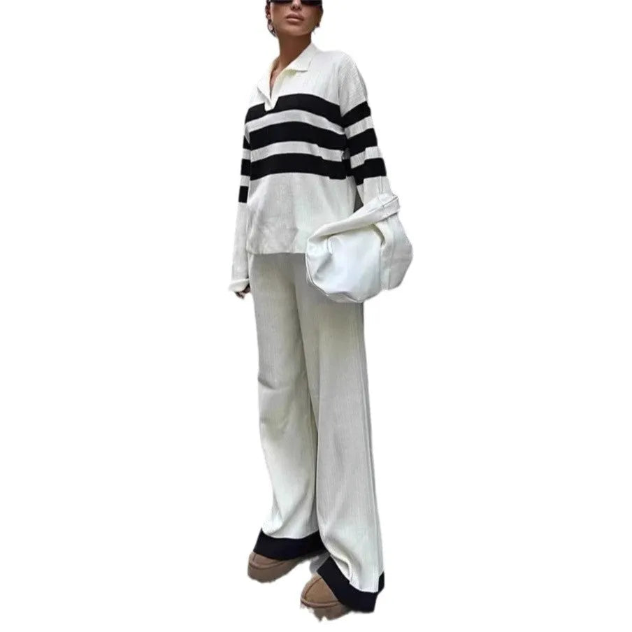 Women's black and white striped two-piece set with polo collar shirt and trousers