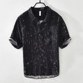 Men's loose fit short sleeve lapel polo shirt in black or white, shown on a hanger.