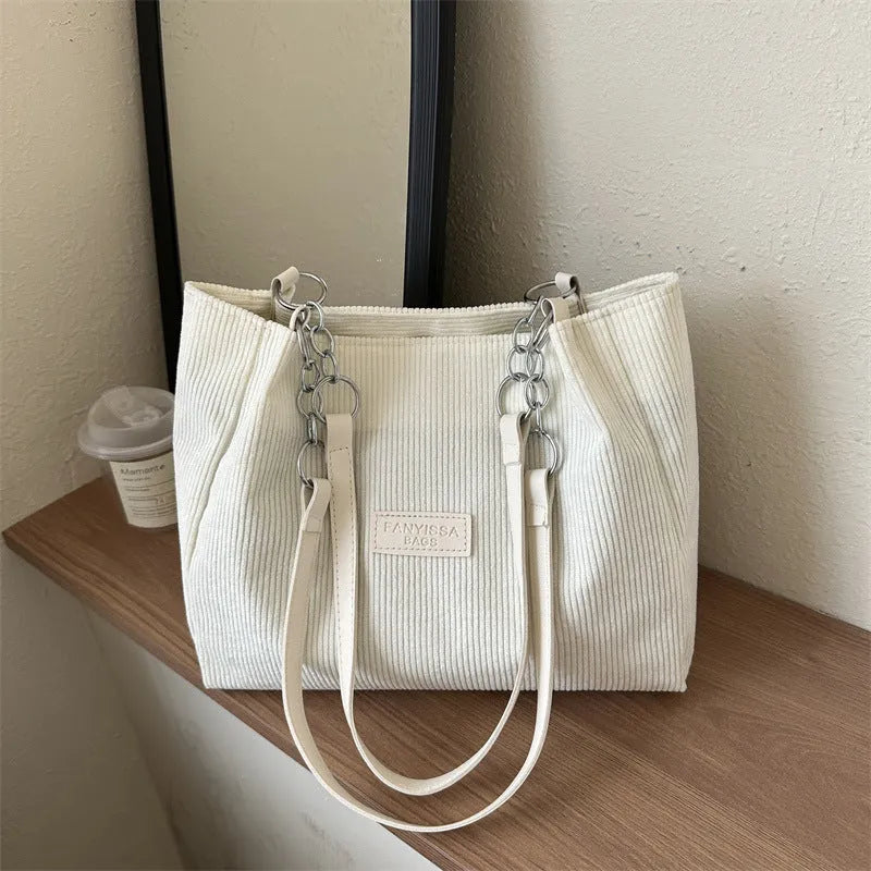 Corduroy one-shoulder tote bag in horizontal square shape with internal pockets