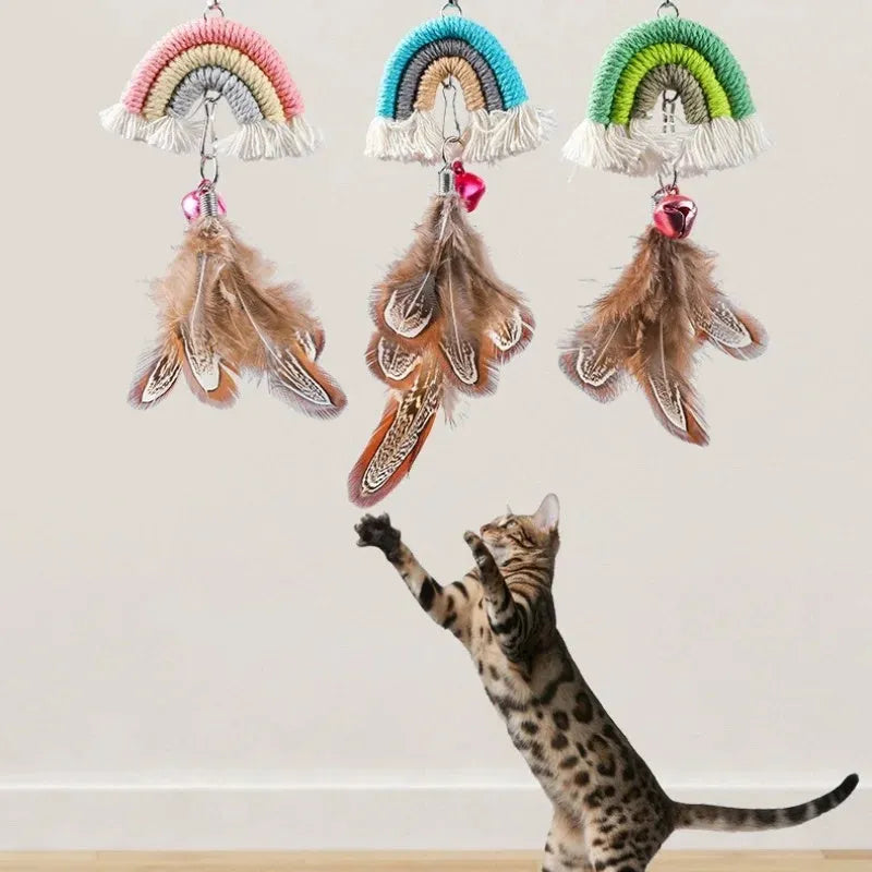 Blue feather rope cat toy hanging from door on elastic cord with adhesive clamp