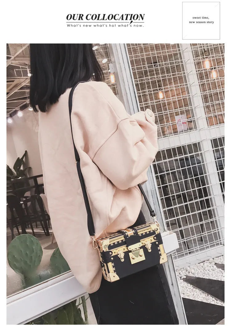Hard-structured women's black PU leather shoulder bag with flap and rivet decoration