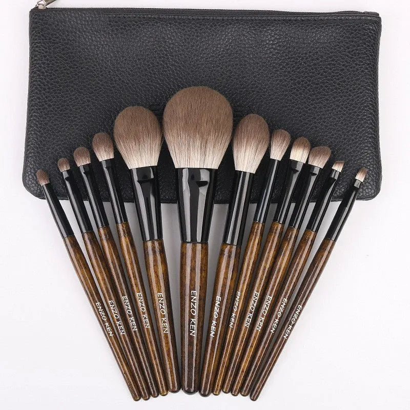 12-piece makeup brush set with wooden handles stored in a black PU zip bag