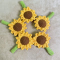 Hand-woven sunflower pen cover in fabric with sunflower design, available as desk storage for pens and pencils