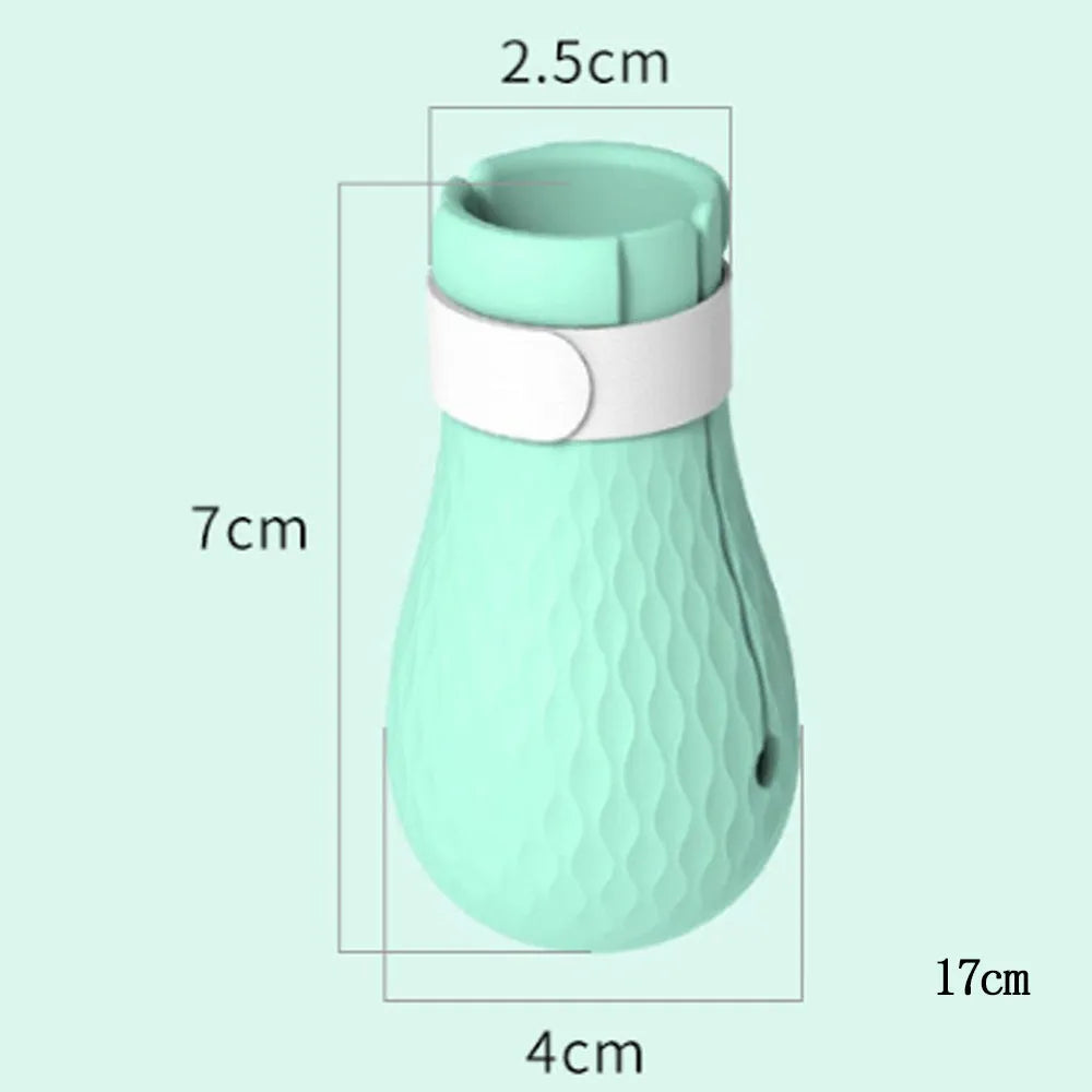 Four green silicone cat paw covers designed to prevent scratching and assist with pet handling