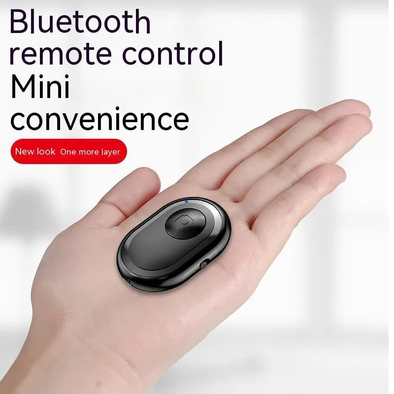 Wireless Bluetooth remote self-timer photo control in black, plastic compact 48mm size