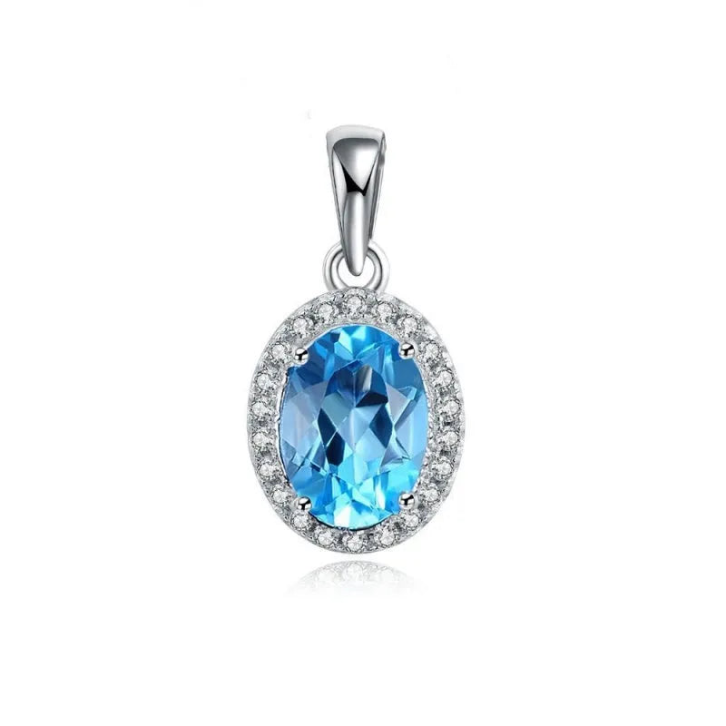 925 sterling silver jewellery set with blue topaz gems showing earrings, ring, pendant, and necklace with geometric design
