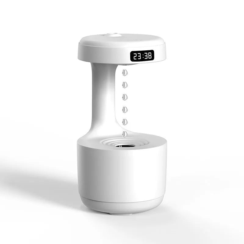 Anti gravity levitating water drops humidifier with LED night light, rose gold white, on desk