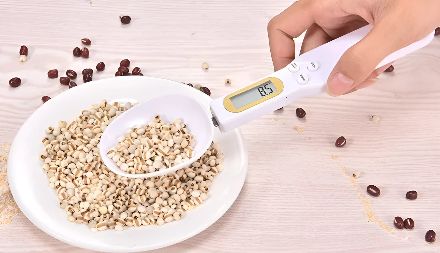 Household electronic measuring spoon scale with ABS plastic body and digital display on a kitchen surface