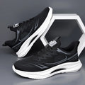 Men's low-top casual shoes in black with woven mesh upper and rubber sole.