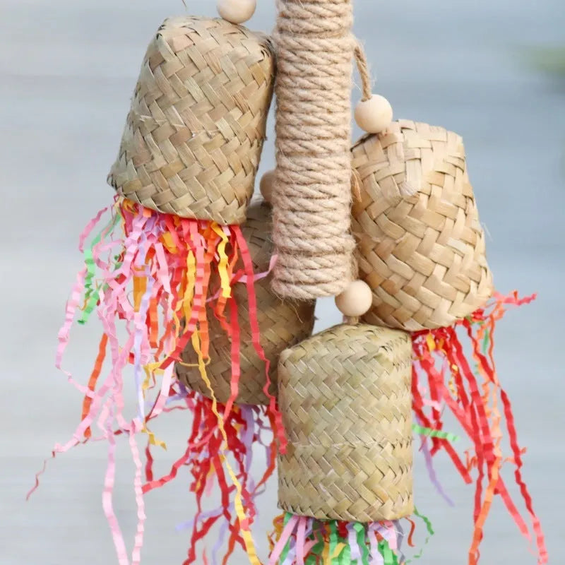 Colourful shredded paper and wood parrot hanging toy with sisal rope, 15 by 35 cm