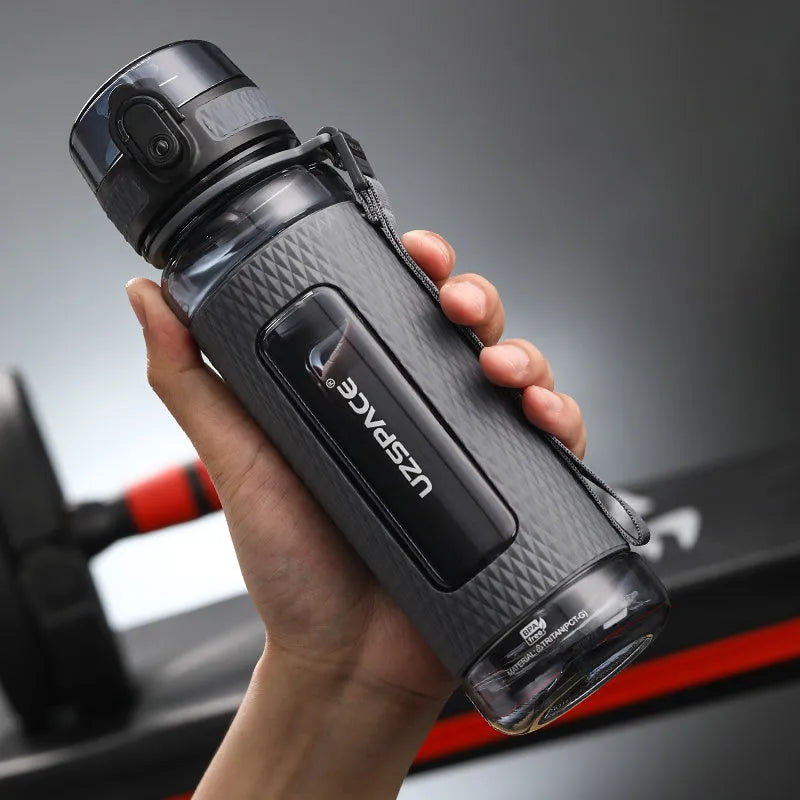 Portable sport water bottle in blue, copolymer polyester plastic, 1100ml capacity, with black cap.
