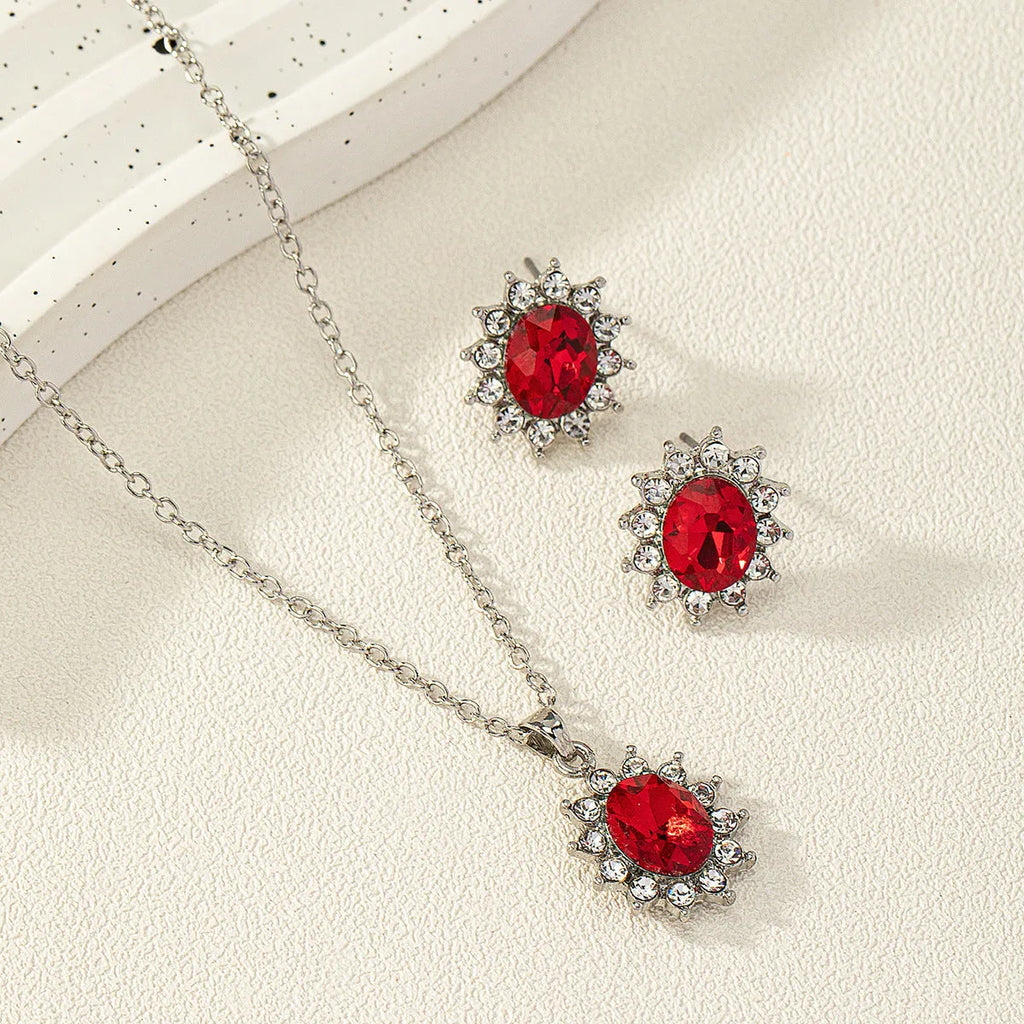 Alloy electroplated oval rhinestone earring and necklace set in blue display
