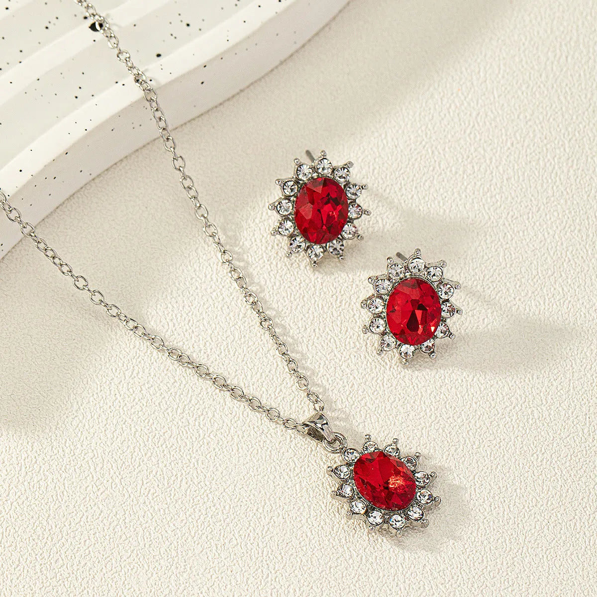Alloy electroplated oval rhinestone earring and necklace set in blue display