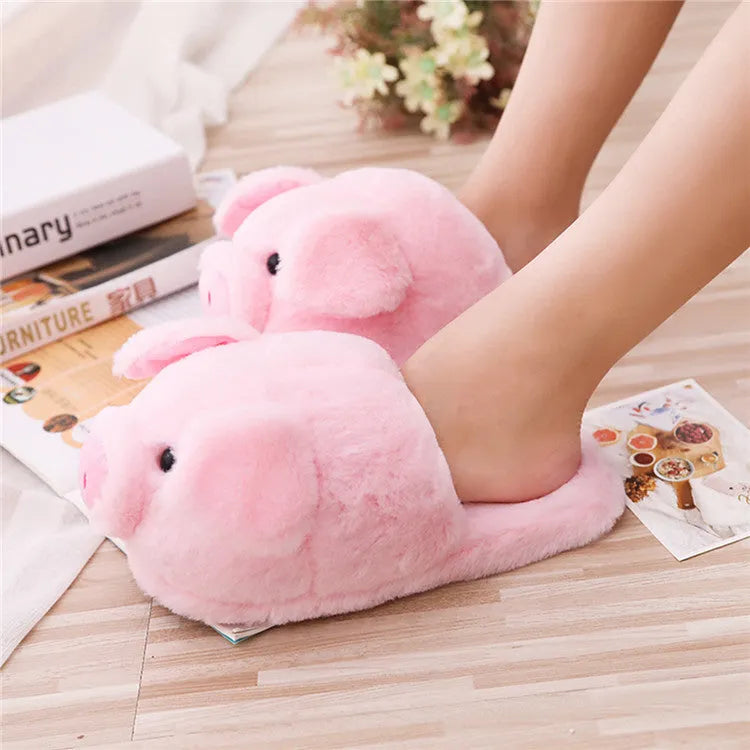 Pink pig floor slippers with soft plush exterior and cushioned interior for indoor wear