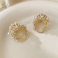 Gold copper drop earrings with small rice-shaped pearl inlay in a flower basket shape for women