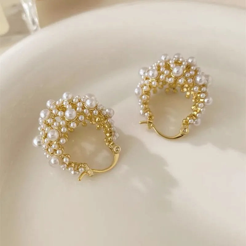 Gold copper drop earrings with small rice-shaped pearl inlay in a flower basket shape for women