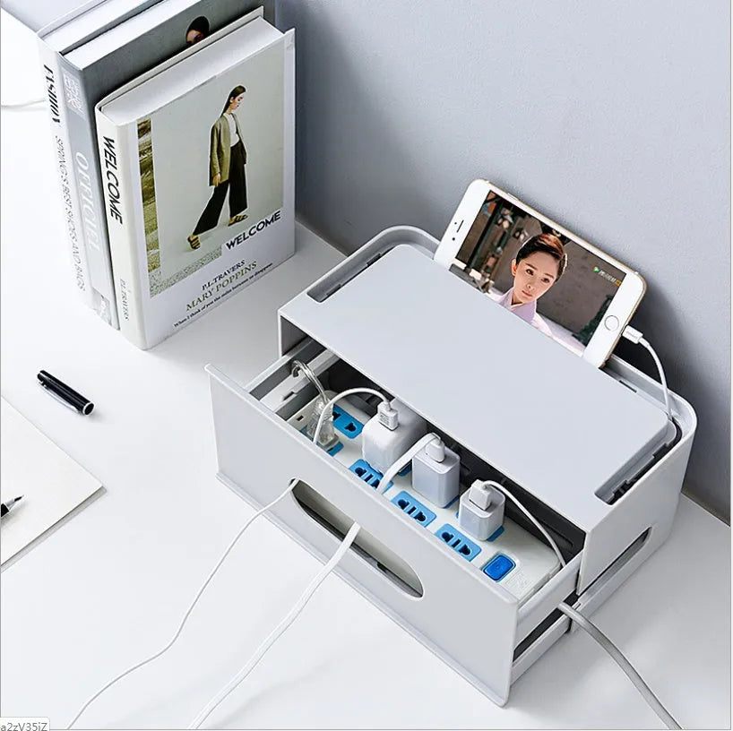 Plastic wireless router storage box in grey, with cable openings, for organising home networking equipment