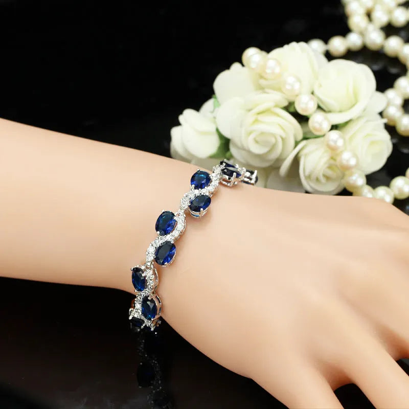 Copper plated gold colour zircon bracelet with geometric design and adjustable 18.4 cm length