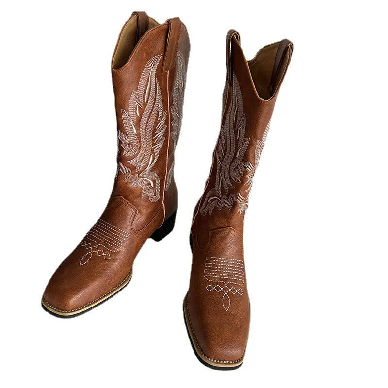 Brown women's embroidered mid-calf Martin boots on a white background, showing round toe and low square heel.