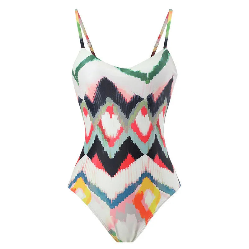 Women's printed two-piece swimsuit with matching hip skirt in striped gradient pattern.