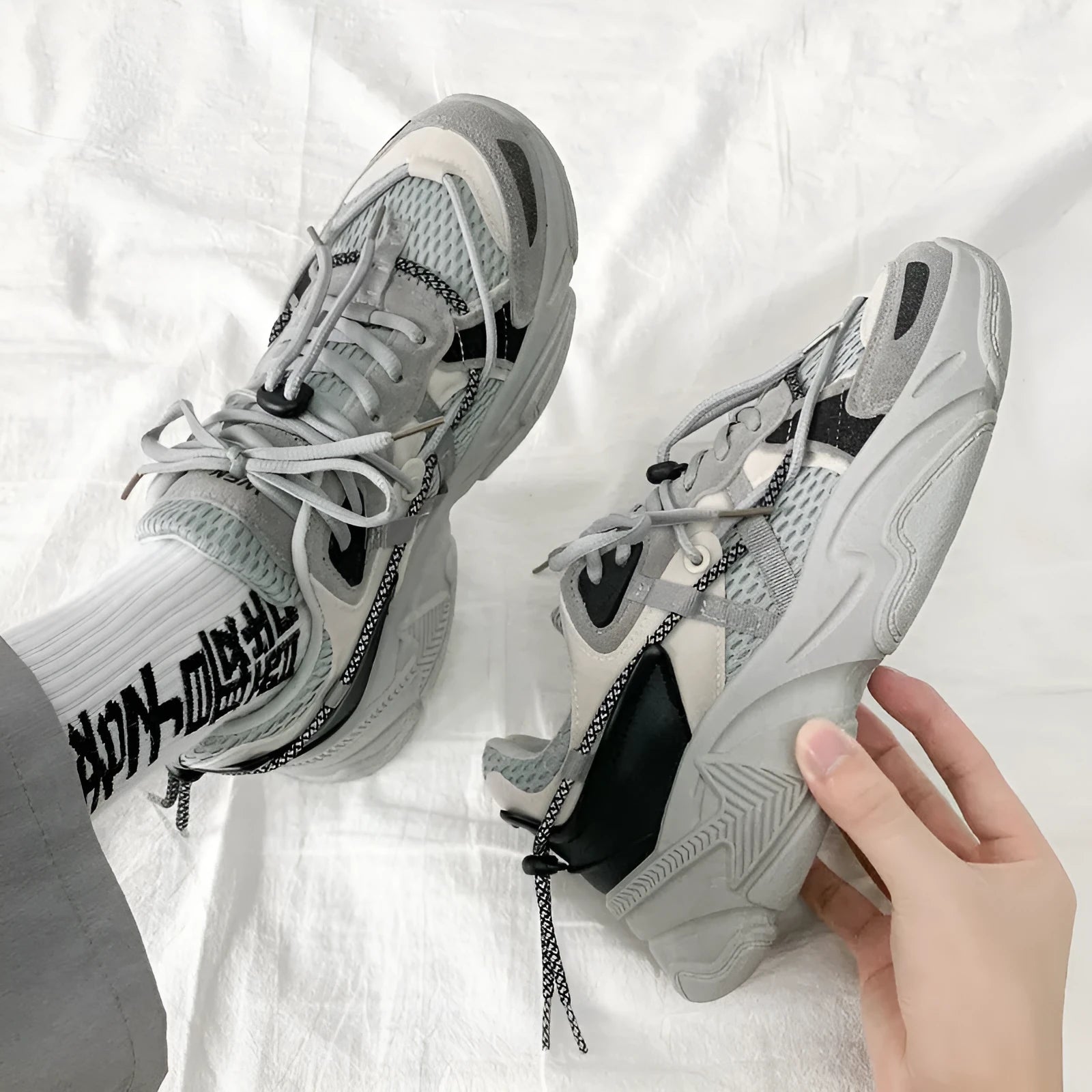 Men's black Korean style platform sports shoes with lace-up front and mesh lining.