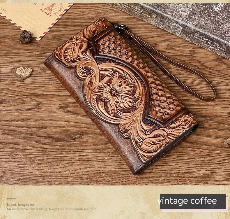 Chinese style embossed leather wallet in tri-fold design showing floral pattern on brown cowhide