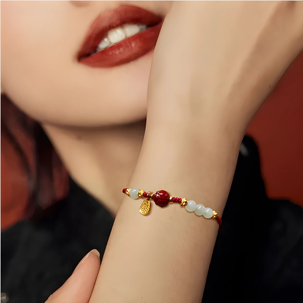 Women's Hetian jade cinnabar red rope bracelet with 925 silver charm and adjustable chain