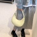 Retro dumpling-shaped women's PU leather shoulder bag in black with sandwich pockets