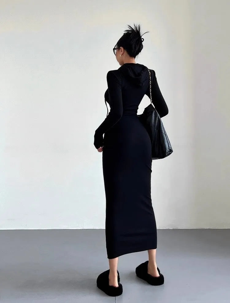 Women's grey hooded long-sleeve sheath dress with a high waist on a model